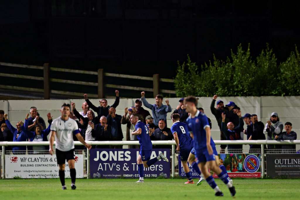 Declan McManus of CPD Dinas Bangor 1876 celebrates his goal during CPD Dinas Bangor 1876 vs Bala Town in Round 1 of the Novira Cymru North at the Bangor City Stadium, Bangor