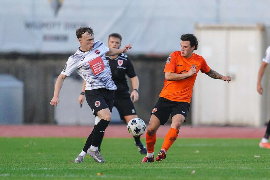 Ethan Edwards of Pontypridd United and Jordan Lloyd Evans of Pure Swansea during the Novira Cymru South fixture Pure Swansea FC vs Pontypridd United at Swansea Bay Sports Park, Swansea, Wales