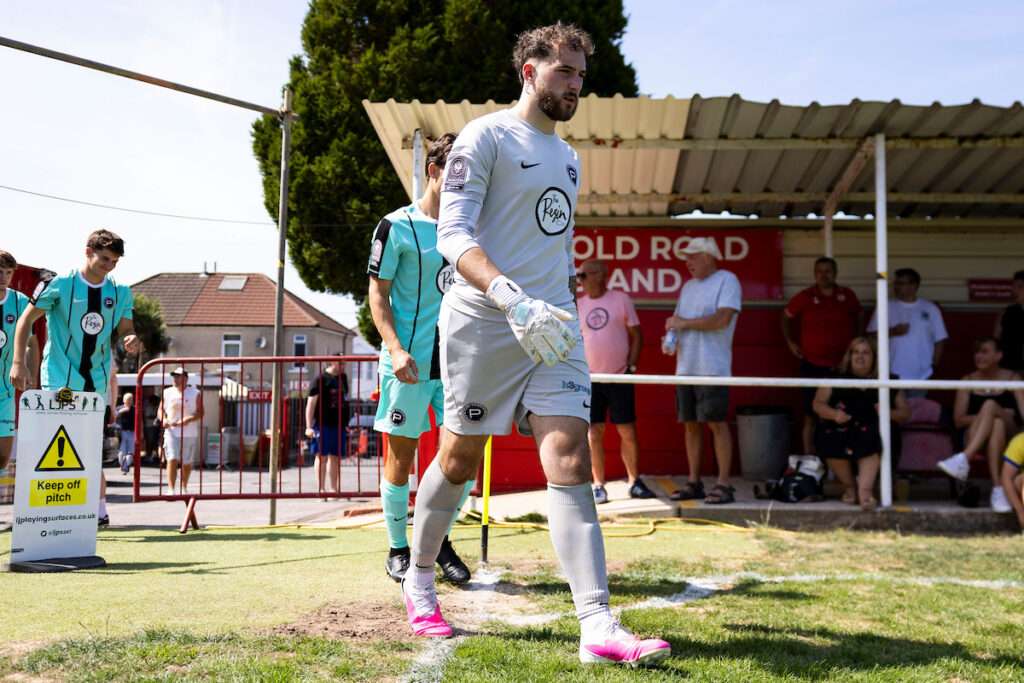 Pure Swansea goalkeeper Kane Draper during the 2026/27 Novira Cymru South match between Baglan Dragons & Pure Swansea at the The Renewable Centre Stadium, Briton Ferry, Wales.