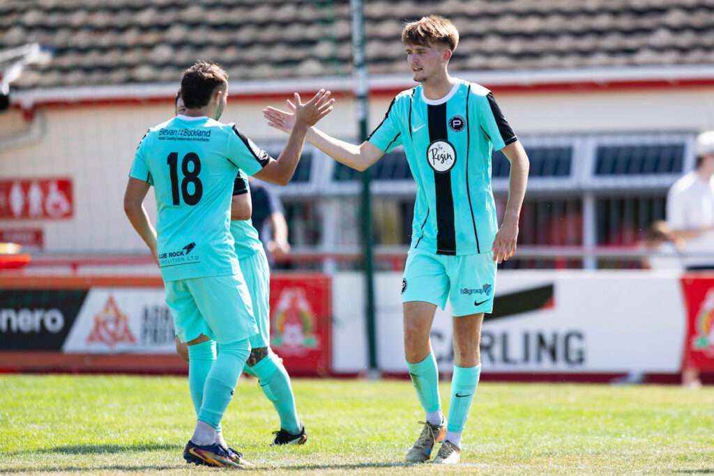 Casey Coughlin of Pure Swans celebrates scoring his sides second goal during the 2026/27 Novira Cymru South match between Baglan Dragons & Pure Swansea at the The Renewable Centre Stadium, Briton Ferry, Wales
