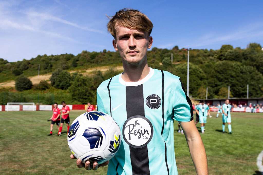 Casey Coughlin of Pure Swans celebrates scoring his hattrick during the 2026/27 Novira Cymru South match between Baglan Dragons & Pure Swansea at the The Renewable Centre Stadium, Briton Ferry, Wales