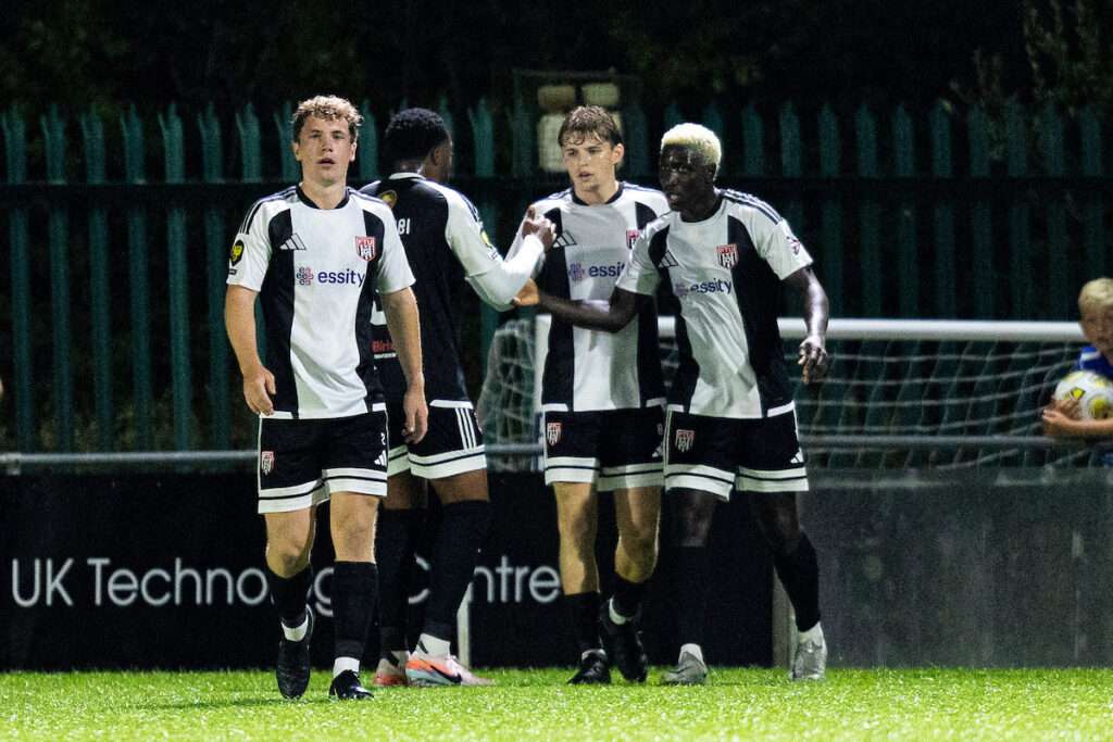 Lassana Mendes of Flint Town United celebrates scoring his sides first goal during the Novira Cymru Premier match between Penybont & Flint Town United at the DragonBet Stadium, Wales