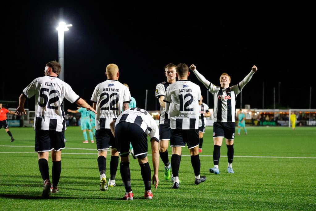 Cameron Morris of Llandudno Town celebrates after scoring a goal to make it 2-0 during the Novira Cymru Premier game between Llandudno Town and Ammanford at the Go Goodwins Stadium in Llandudno