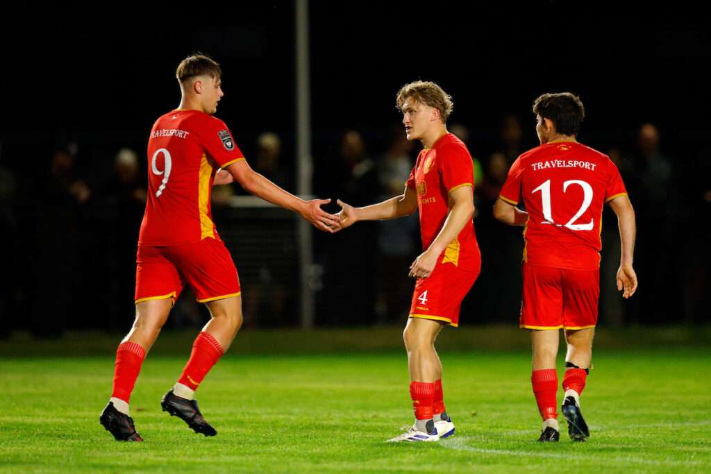 Alfie Vaughan of Denbigh Town celebrates after scoring a goal to make it 2-1 during the Novira Cymru North game between Ruthin Town and Denbigh Town at the Memorial Playing Fields, Ruthin