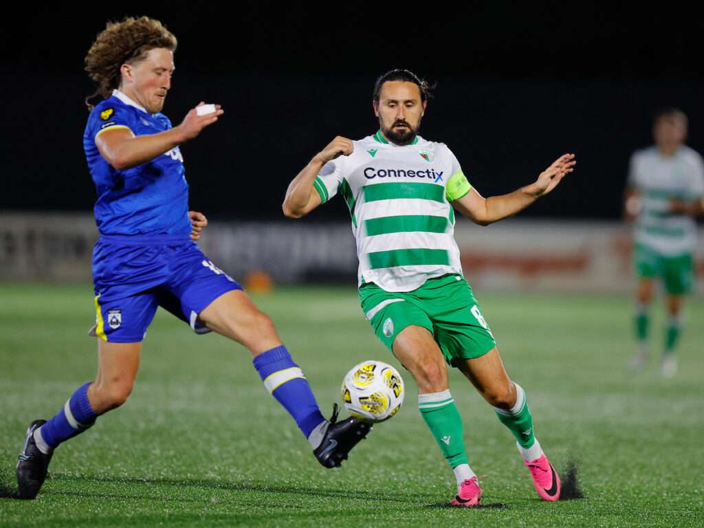 Greg Walters of Haverfordwest County and Ryan Brobbel of The New Saints during the Novira Cymru Premier game between The New Saints and Haverfordwest County at Park Hall Stadium in Oswestry