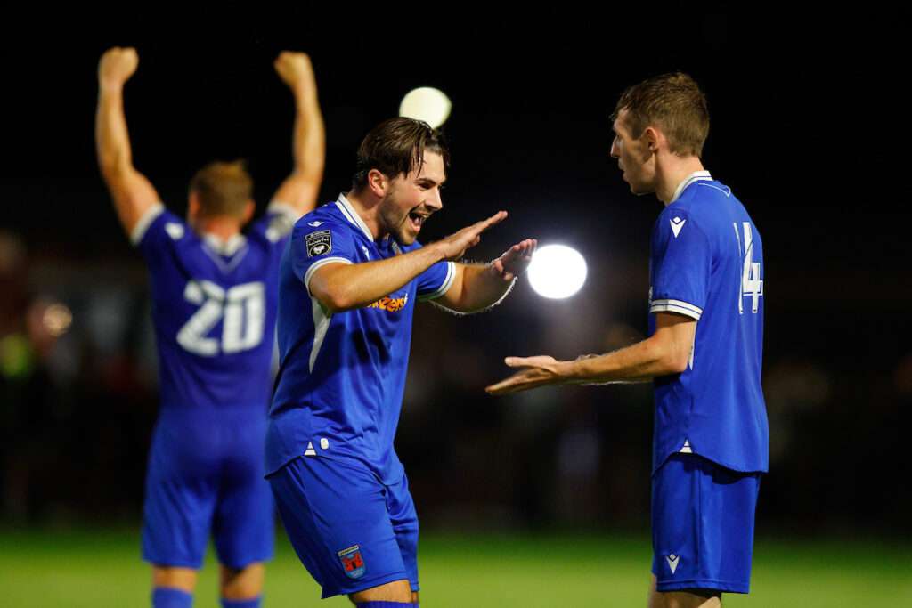 Mitchell Williams of Ruthin Town and Tom Weyman of Ruthin Town celebrate at full time during the Novira Cymru North game between Ruthin Town and Denbigh Town at the Memorial Playing Fields, Ruthin