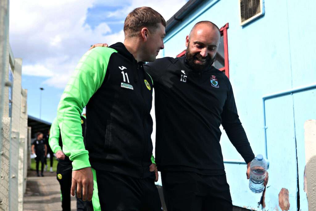 Caernarfon's Rob Hughes and Colwyn Bay's Danny Holmes before CPD Bae Colwyn vs CPD Tref Caernarfon in Round 1 of the JD Cymru Premier at The 4 Crosses Construction Arena, Old Colwyn, Colwyn Bay