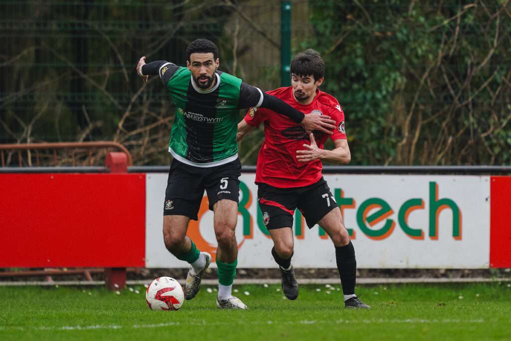 Kane Auld of Aberystwyth Town and Kostya Georgievsky of Trefelin BGC during the JD Cymru South 2025/26 fixture Trefelin BGC vs Aberystwyth Town at Ynys Park, Port Talbot, Wales