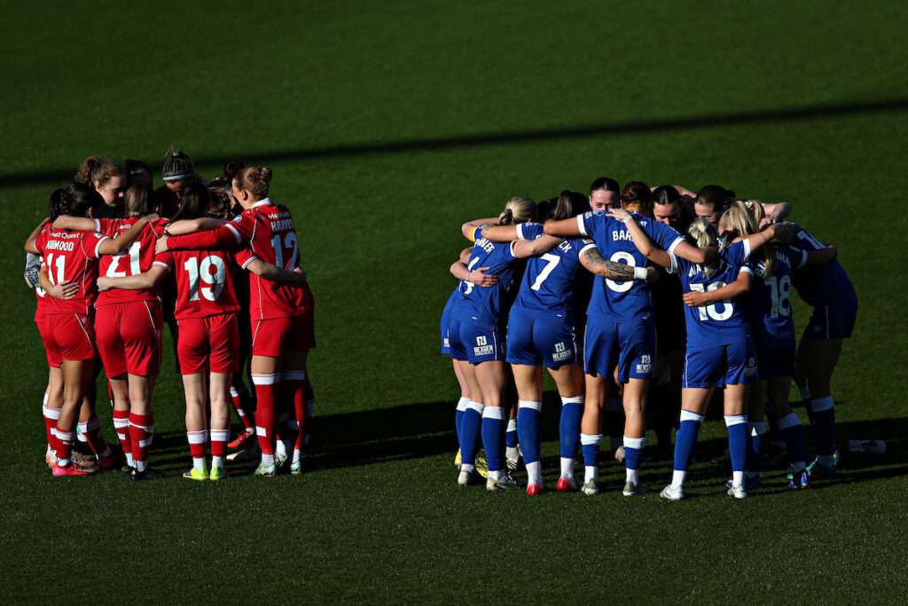 Both teams huddle before Wrexham AFC Women vs Cardiff City Women in Round 5 of the Genero Adran Premier Championship at the SToK Cae Ras, Wrexham