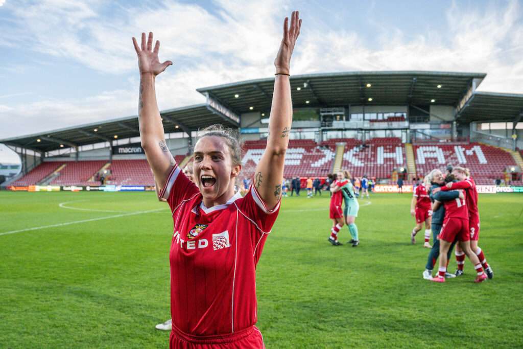 Rosie Hughes of Wrexham celebrates at the end of the Genero Adran Premier game between Wrexham and Cardiff City at the Racecourse Ground in Wrexham