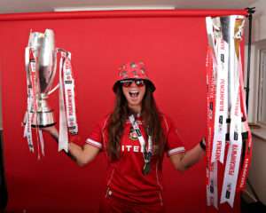 Rosie Hughes of Wrexham AFC Women celebrates with the Genero Adran Premier Trophy after Wrexham AFC Women vs Swansea City Women in Round 6 of the Genero Adran Premier Championship at The Rock, Cefn Mawr