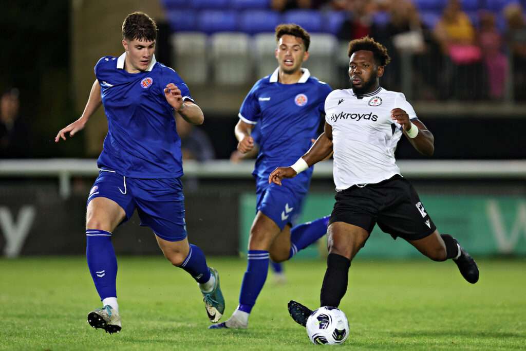 Adam Long of CPD Dinas Bangor 1876 tackles Osebi Abadaki of Bala Town during CPD Dinas Bangor 1876 vs Bala Town in Round 1 of the Novira Cymru North at the Bangor City Stadium, Bangor