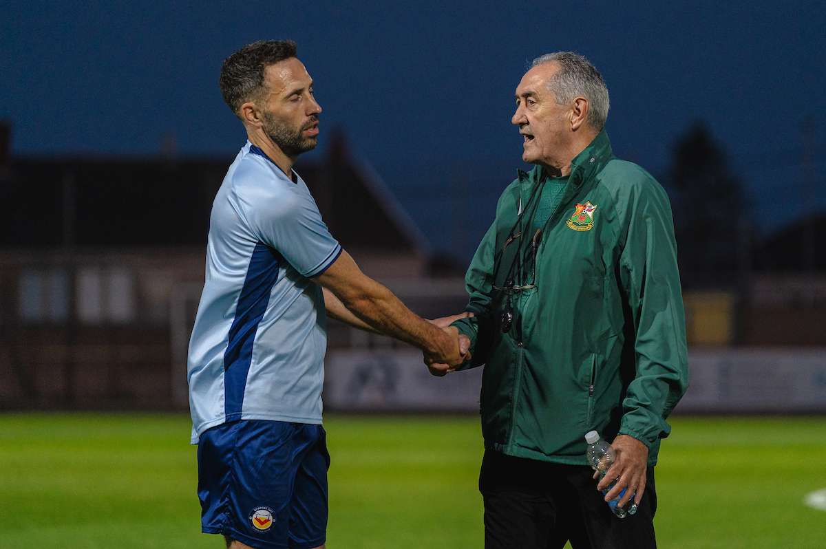 Llanelli Town Manager Terry Boyle and Newport City Manager Robbie Willmot during the Novira Cymru South fixture Llanelli Town vs Newport City at Stebonheath Park, Llanelli, Wales