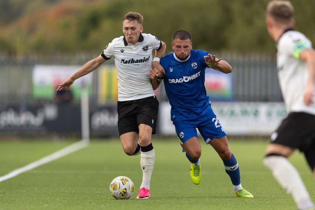 ,Nathan Wood of Penybont and Clayton Green of Haverfordwest County battle for the ball during the Novira Cymru Premier 2026/27 fixture Haverfordwest County vs Penybont at Ogi Bridge Meadow, Haverfordwest, Wales