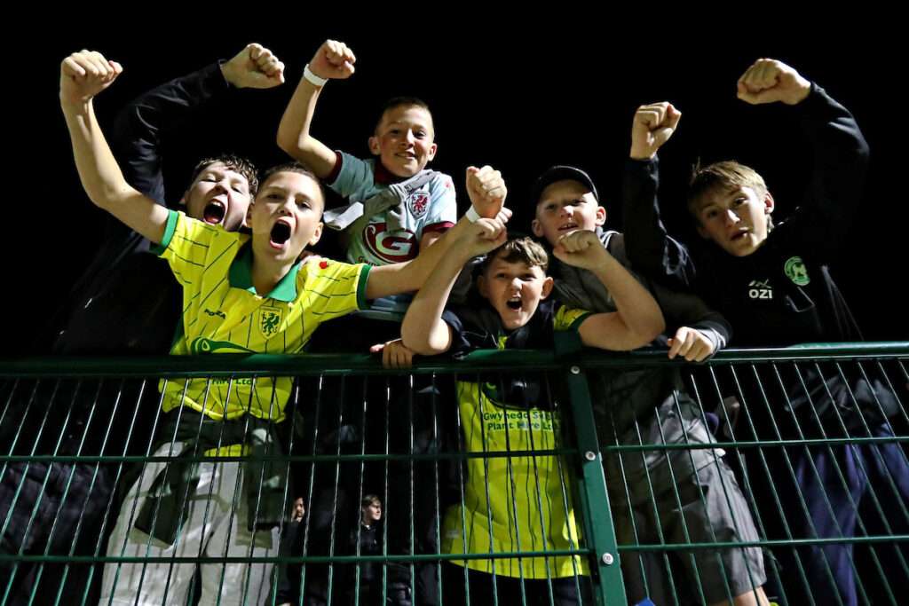 Caernarfon fans celebrate after Caernarfon Town vs Flint Town United in Round 7 of the Novira Cymru Premier at the Oval, Caernarfon