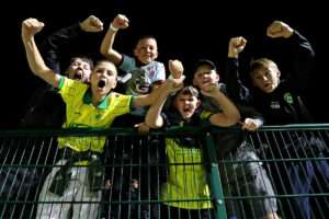 Caernarfon fans celebrate after Caernarfon Town vs Flint Town United in Round 7 of the Novira Cymru Premier at the Oval, Caernarfon