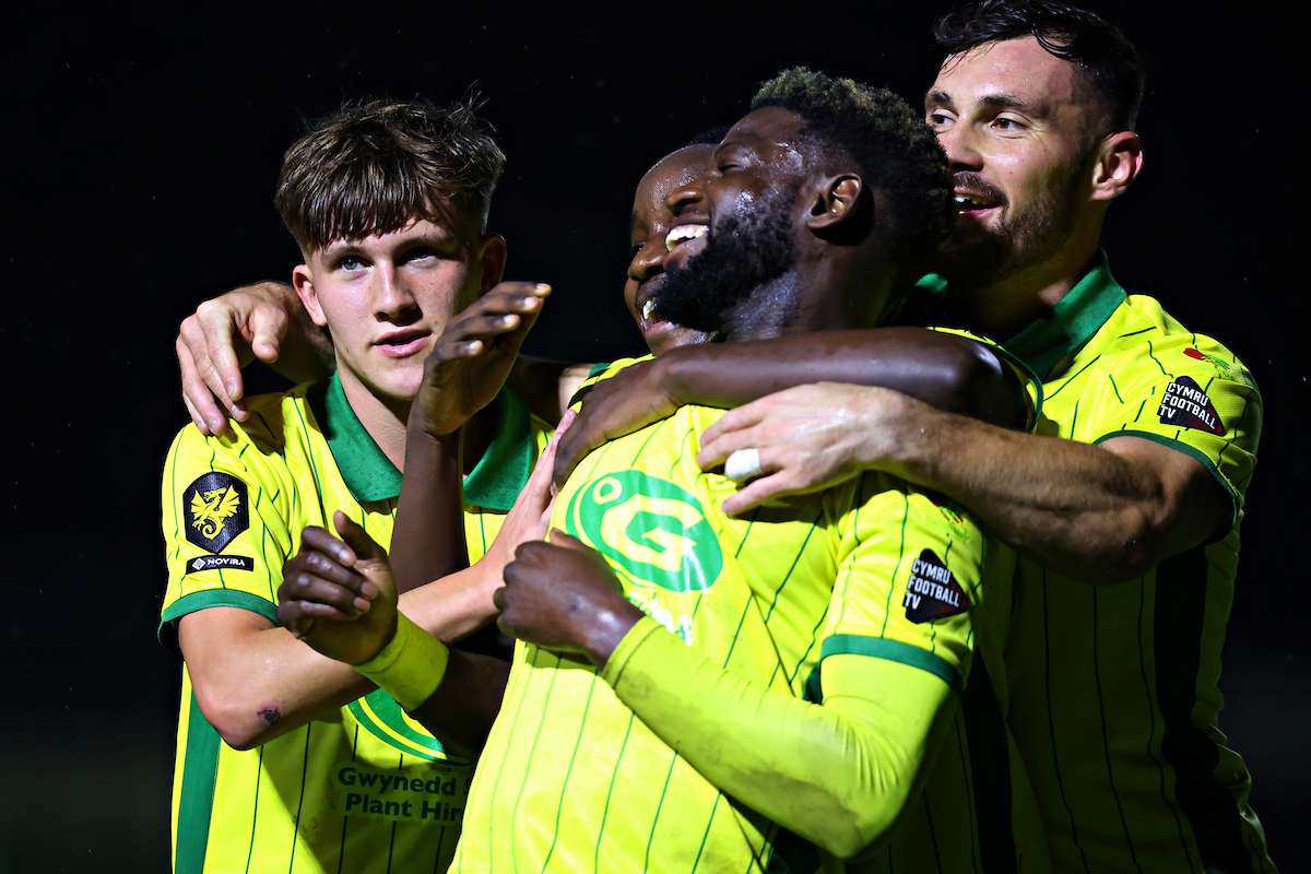 Caernarfon Town's Offrande Zanzala celebrates his goal during Caernarfon Town vs Cambrian United in Round 10 of the Novira Cymru Premier at The Oval, Caernarfon