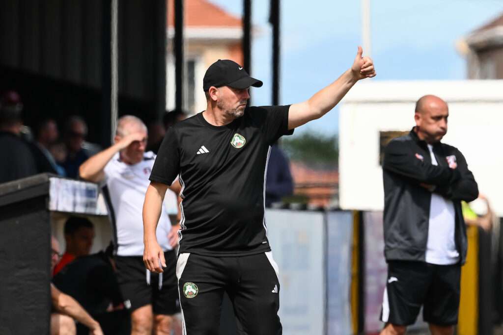 Paul Moore, Manager of Rhyl 1879 gives the thumbs up to his players during the Novira Cymru North game between Rhyl 1879 and Guilsfield at the Hops and Barley Community Stadium in Rhyl