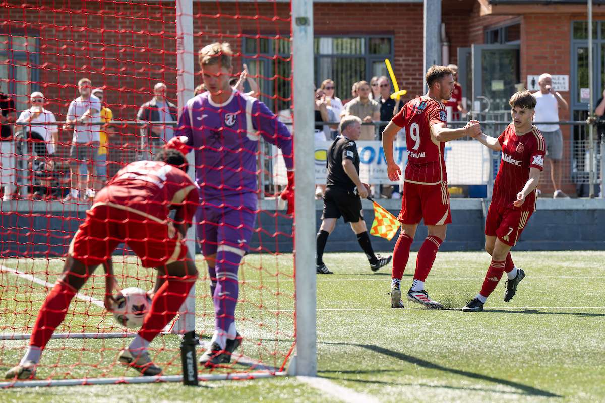 Josh Astley of Newtown celebrates his goal to make it 1-1 during the Novira Cymru North game between Newtown and Guilsfield at Latham Park in Newtown
