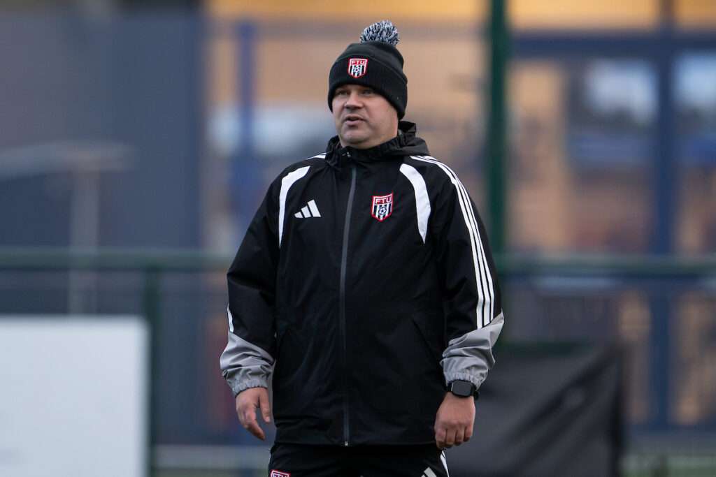 Manager Lee Fowler during the pre-game warmup ahead of the Novira Cymru Premier game between Airbus UK Broughton and Flint Town United at The Hollingsworth Group Stadium in Broughton