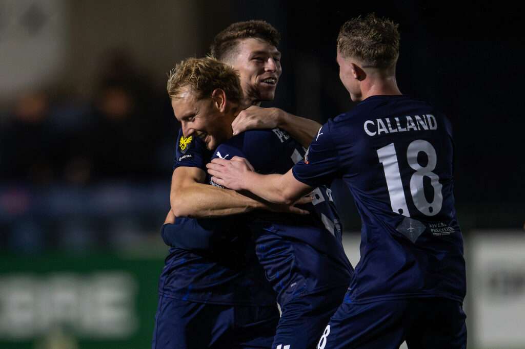 George Peers of Airbus UK Broughton celebrates his goal to make it 3-0 during the Novira Cymru Premier game between Airbus UK Broughton and Flint Town United at The Hollingsworth Group Stadium in Broughton