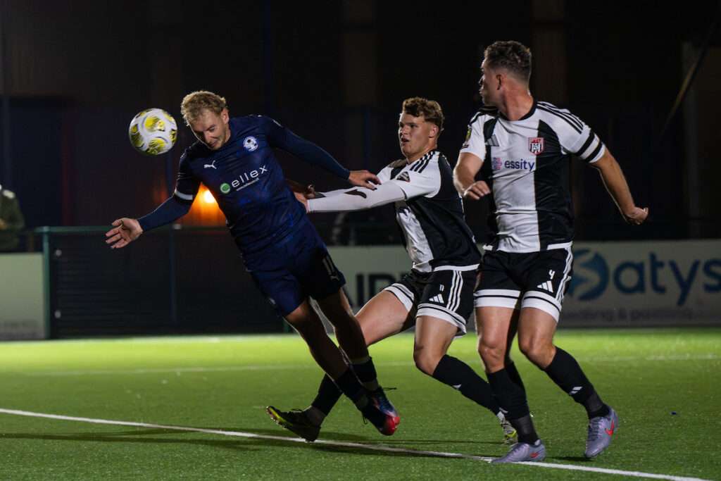 George Peers of Airbus UK Broughton scores his hat-trick goal to make the score 4-0 during the Novira Cymru Premier game between Airbus UK Broughton and Flint Town United at The Hollingsworth Group Stadium in Broughton