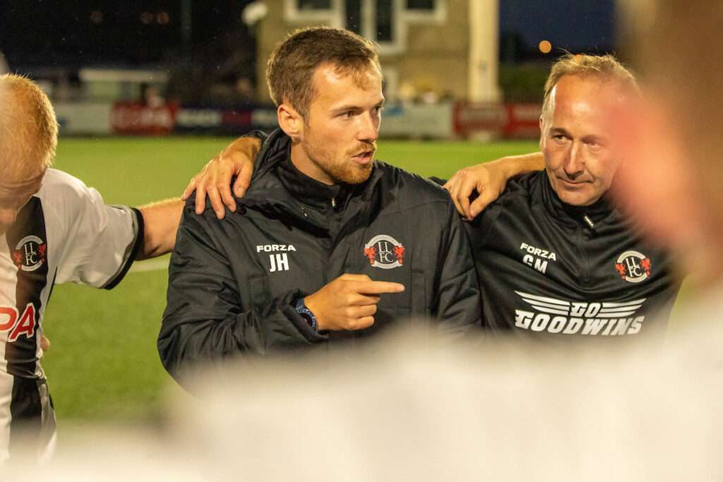 LLANDUDNO, WALES - 31 JULY 2026: Llandudno Manager, Jordan Hadaway speaks to his players following the 2026-27 Novira Cymru Premier match between Llandudno and Flint Town United at Go Goodwins Stadium, Llandudno, Wales. (Pic by Nik Mesney/FAW)