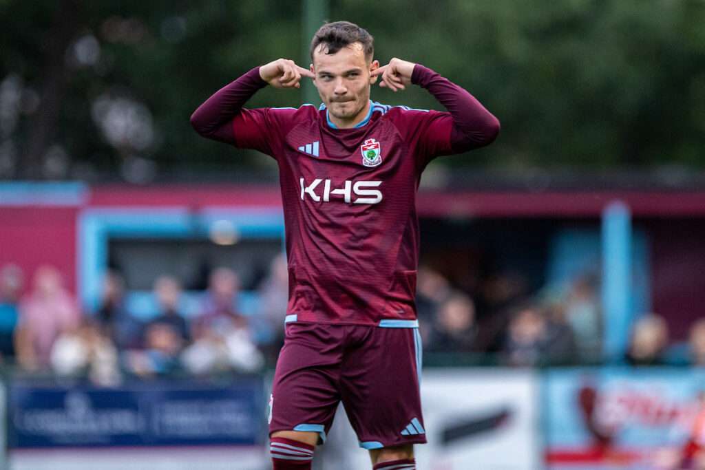 Jordan Davies of Colwyn Bay celebrates his equalising goal during the 2026-27 Novira Cymru Premier match between Colwyn Bay and Connah's Quay Nomads at Blue Turtle Arena, Colwyn Bay, Wales. 