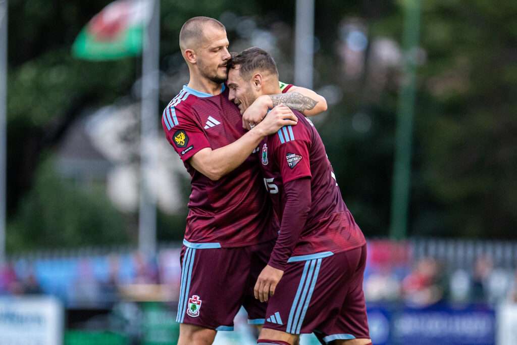 Jordan Davies of Colwyn Bay celebrates his equalising goal during the 2026-27 Novira Cymru Premier match between Colwyn Bay and Connah's Quay Nomads at Blue Turtle Arena, Colwyn Bay, Wales