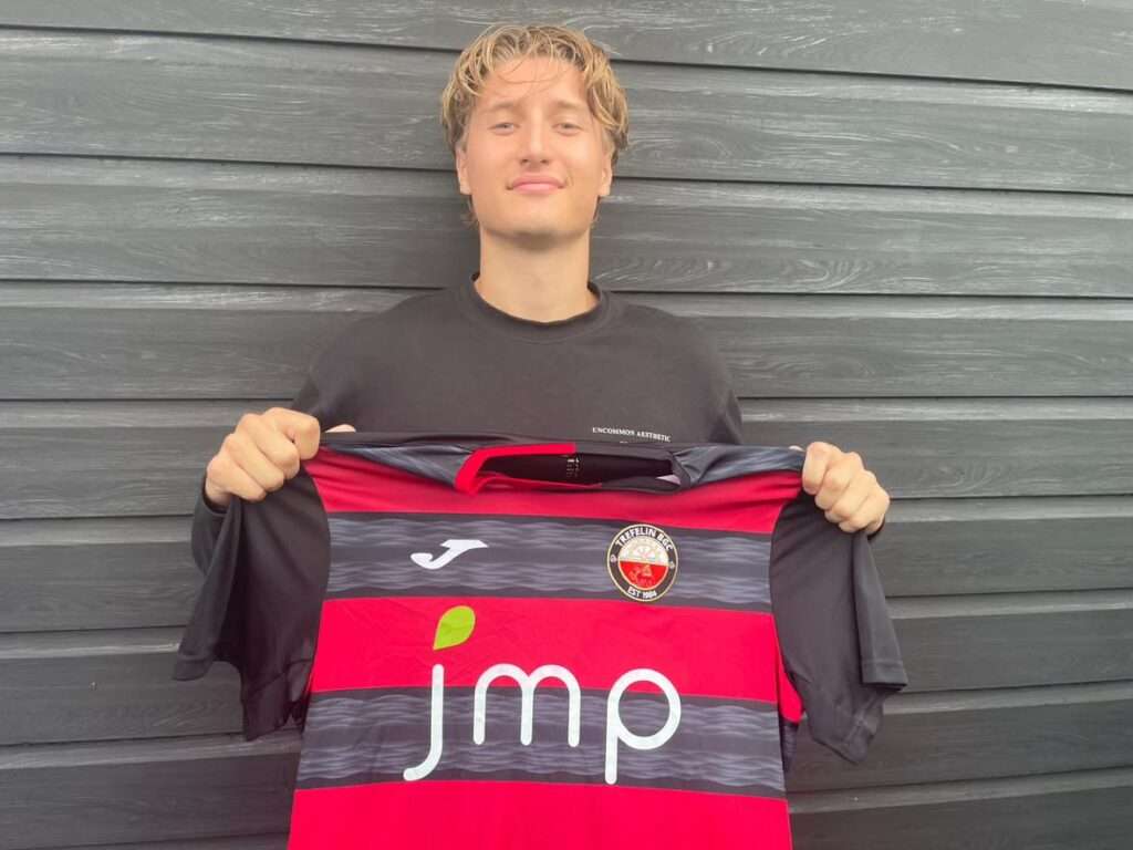 Owen Degelman poses with a Trefelin shirt
