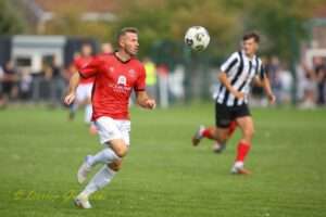Lewis Harling dribbles with the ball against Cardiff Dracs in the Cymru South fixture