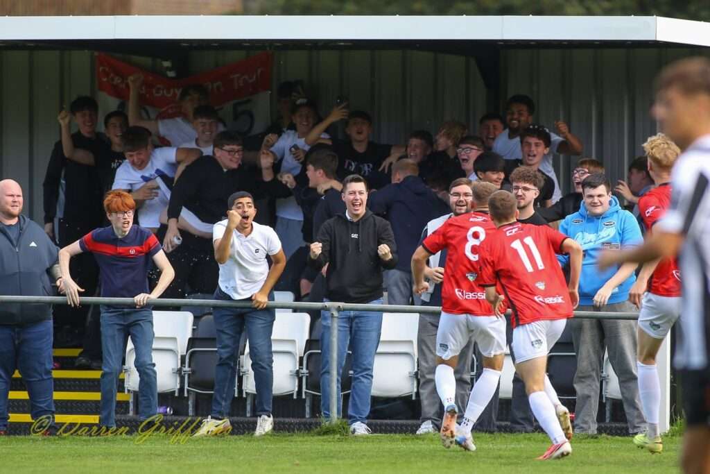 Caerau Ely players celebrate after Lewis Harling's goal against Cardiff Dracs
