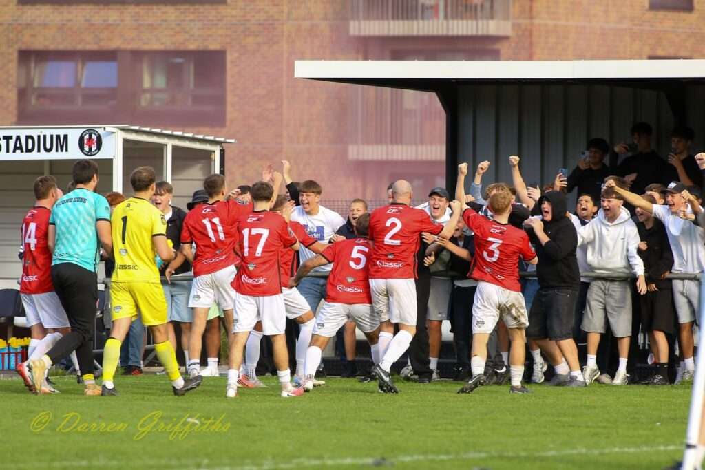 Caerau Ely fans celebrate with the players after beating Cardiff Dracs in the Cymru Leagues South