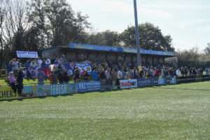 Supporters on the 'Bont' Bank during the Cymru Premier match between Penybont and Airbus UK Broughton.