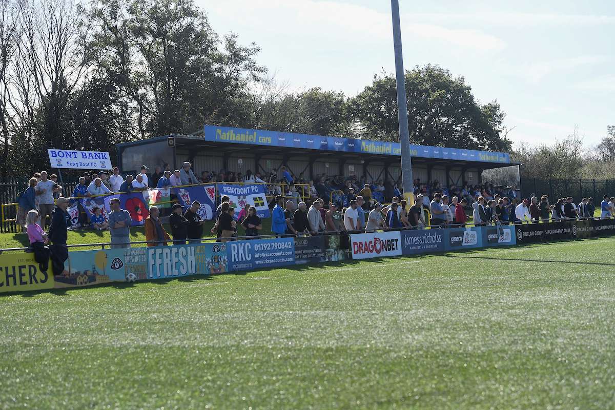 Supporters on the 'Bont' Bank during the Cymru Premier match between Penybont and Airbus UK Broughton.