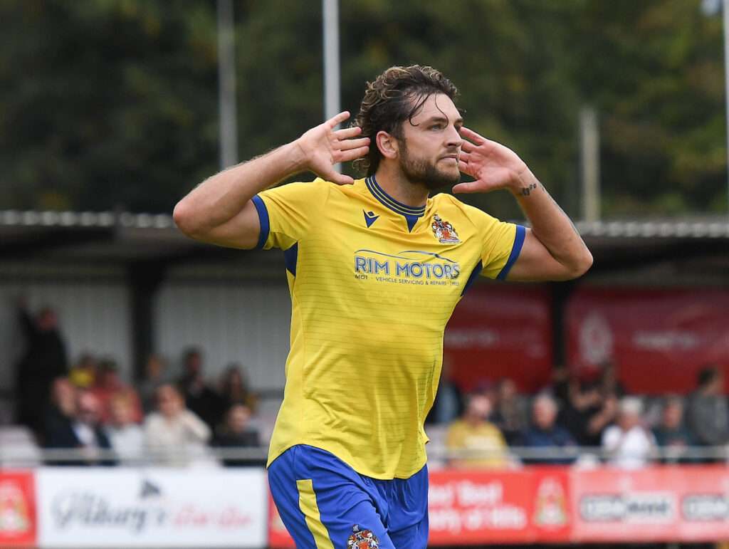 Barry Town's Elliot Dugan celebrates his hat-trick against Briton Ferry Llansawel in the Cymru Premier