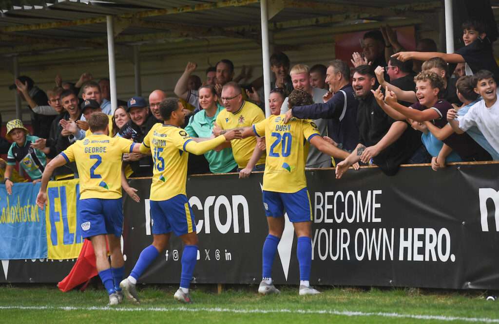 BRITON FERRY, WALES - 01 SEPTEMBER 2026: during the Novira Cymru Premier 26/27 Phase 1 match between Briton Ferry Llansawel FC and Barry Town United AFC at the Renewable Centre Stadium in Briton Ferry on the 31sr August 2026. (Pic by Ian Cook/FAW) -Barry Town's Elliot Dugan celebrates his hat-trick
