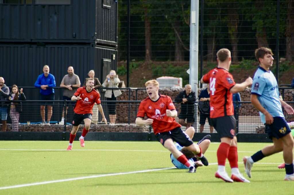 Caerau Ely celebrate a goal against Treowen Stars