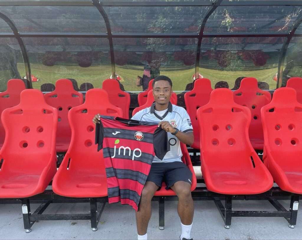Bayan Aman poses with a Trefelin shirt