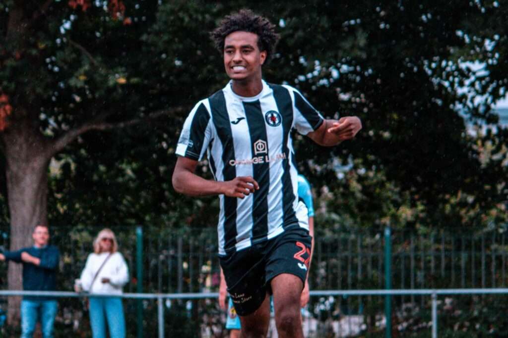 Haben Samson celebrates scoring for Cardiff Dracs against Baglan Dragons in the Cymru South