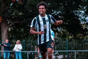 Haben Samson celebrates scoring for Cardiff Dracs against Baglan Dragons in the Cymru South