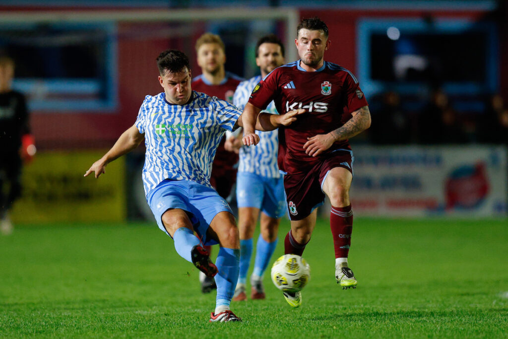 Sam Snaith of Cardiff Met and Ethan Roberts of Colwyn Bay during the Novira Cymru Premier game between Colwyn Bay and Cardiff Met at The Blue Turtle Arena in Colwyn Ba