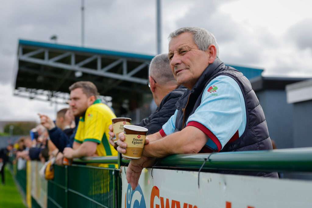 Fans of Caernarfon Town look on during the Novira Cymru Leagues Premier game between Caernarfon Town and The New Saints at the The Oval Stadium in Caernarfon