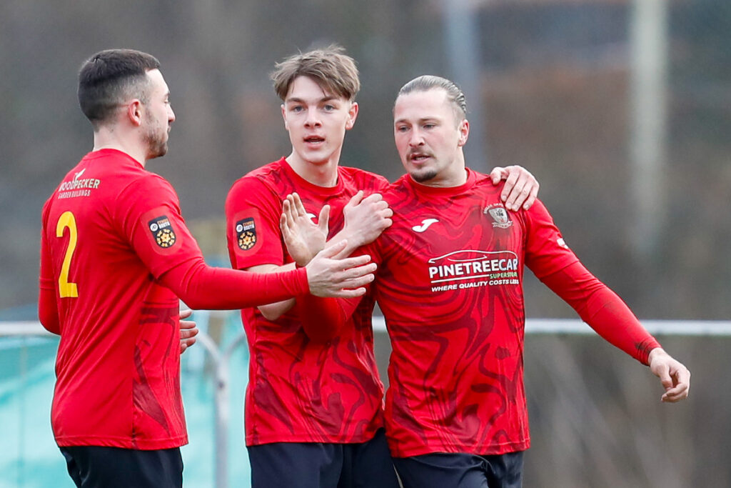 Nathan Logan of Baglan Dragons FC celebrates after scoring during the 2024/25 JD Cymru South fixture between Baglan Dragons FC and Caerau Ely