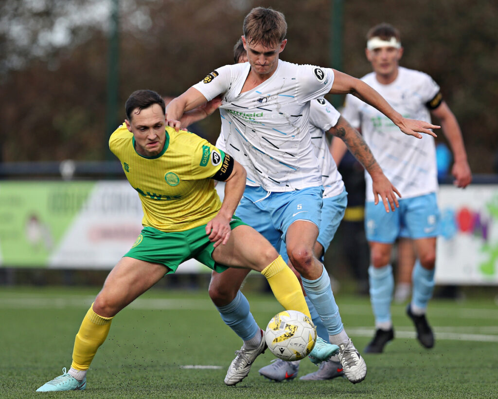  Sam Richards of Cardiff Met pressures Danny Gossett of Caernarfon Town during Caernarfon Town vs Cardiff Met FC 