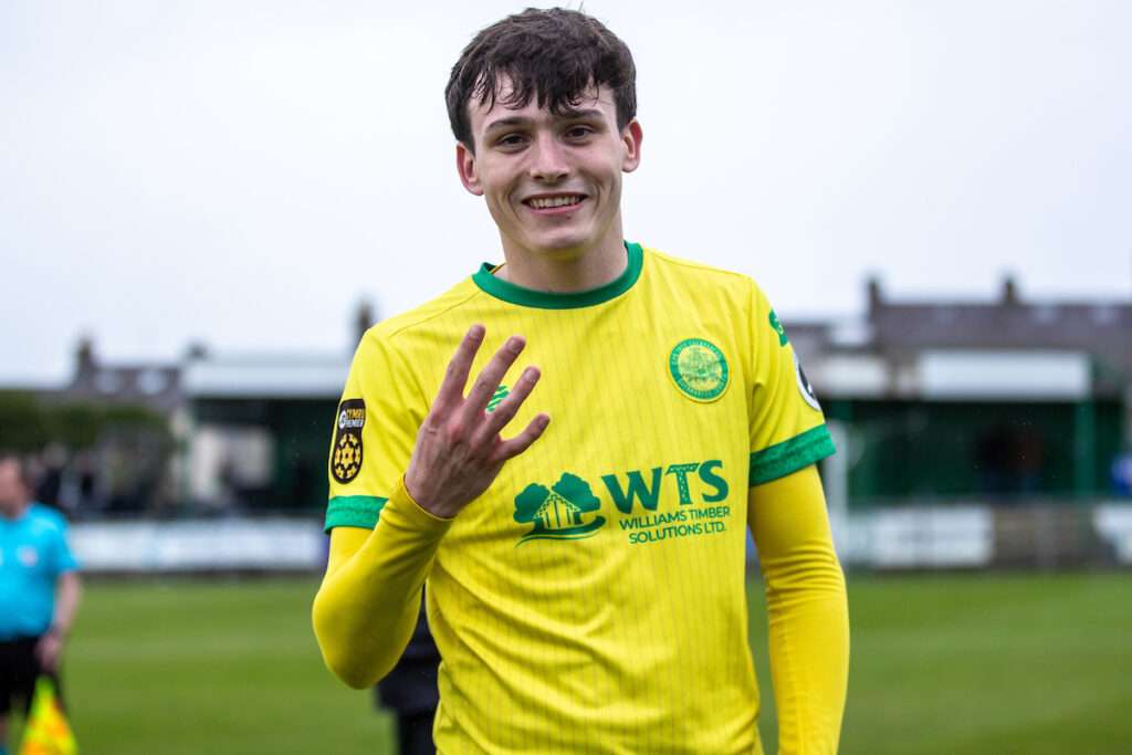 Caernarfon Town's Louis Lloyd celebrates his four goals at full time following the JD Cymru Premier Playoff fixture between Caernarfon Town and Barry Town United at the Carling Oval, Caernarfon, Wales 