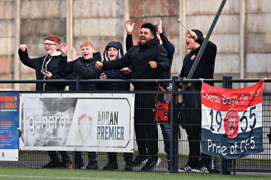 Caerau fans celebrate after Aberystwyth Town vs Caerau Ely AFC in Round 24 of the JD Cymru South at Park Avenue, Aberystwyth