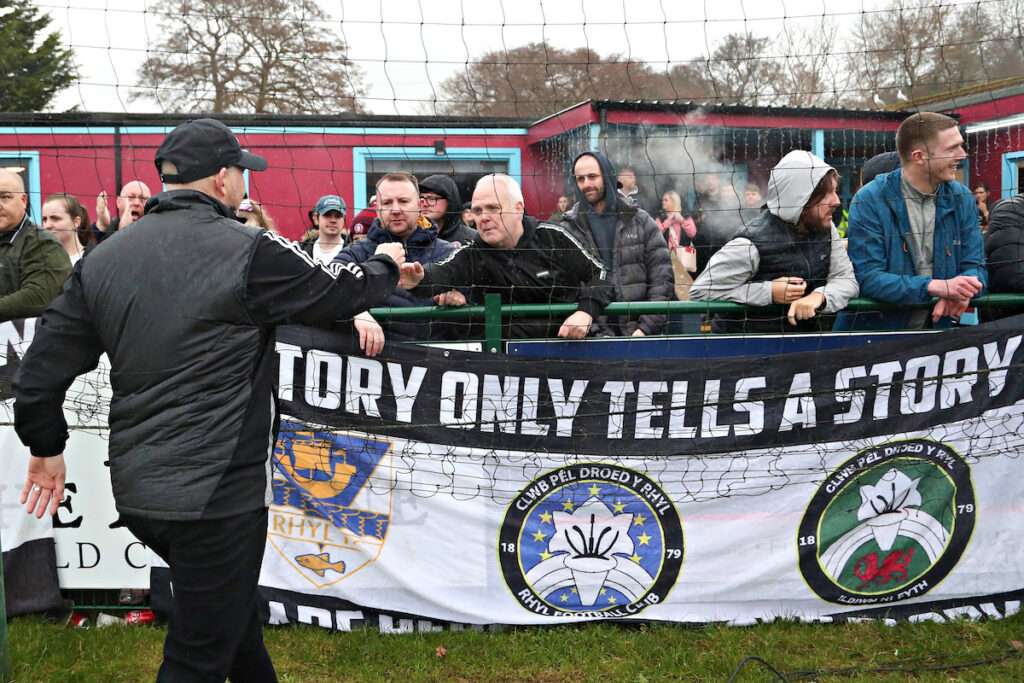 Paul Moore, Manager of Rhyl 1879 with fans after the JD Welsh Cup Semi-Final between Rhyl 1879 and Caernarfon Town at The Blue Turtle Arena in Colwyn Bay