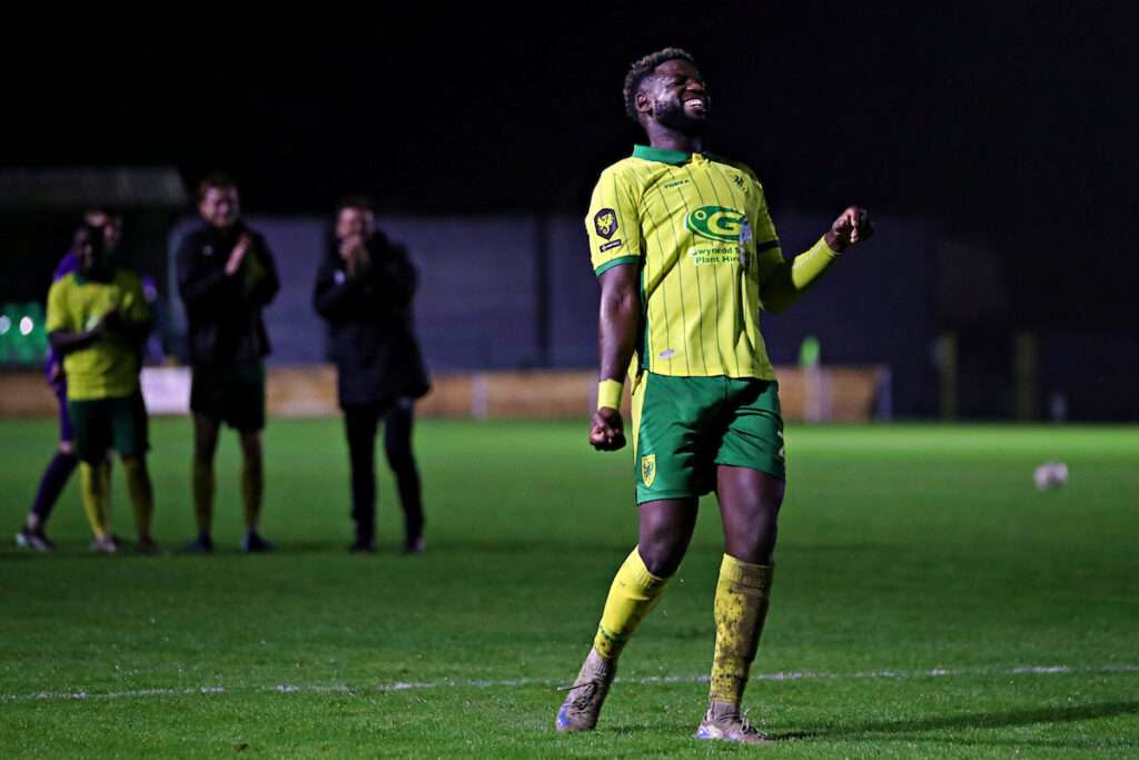 Caernarfon Town's Offrande Zanzala celebrates after Caernarfon Town vs Cambrian United in Round 10 of the Novira Cymru Premier at The Oval, Caernarfon