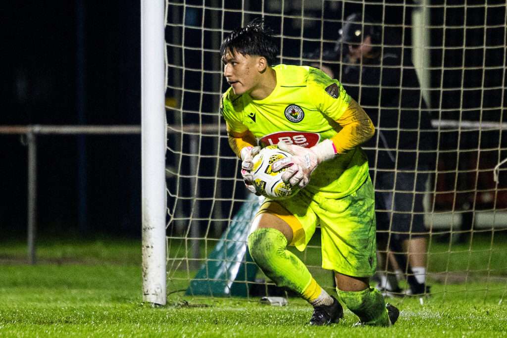 Ammanford’s Tom Wright saves a penalty during the 2026/27 Novira Cymru Premier match between Ammanford & Penybont at the Recreation Ground, Ammanford, Wales